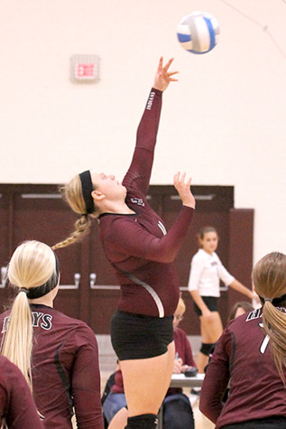 Senior Audra Schmeidler goes to hit the ball after a set. 