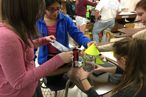 Juniors Jeanie Balzer, Megan Scott, Karen Guzman and Madison Crees create their bottle rockets.