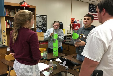 Juniors Katie Fross, Rachel Taylor and Thomas Harman create their bottle rocket.
