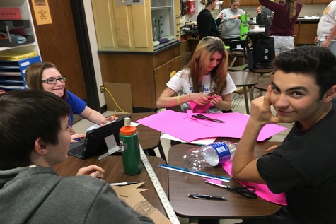 Juniors Jacob Hecker, Jacob Alexander, Courtney Molleker and Jordyn Dake create their bottle rocket.