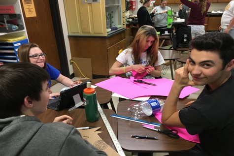 Juniors Jacob Hecker, Jacob Alexander, Courtney Molleker and Jordyn Dake create their bottle rocket. 