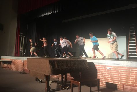 Junior Ryan Will, junior Michael Hernandez, junior Adam Klausmeyer, junior Tanner Eiland, senior Cooper Flores, and senior Eric Rorstrom dance with choreographer Tawnita Augustine during auditions.