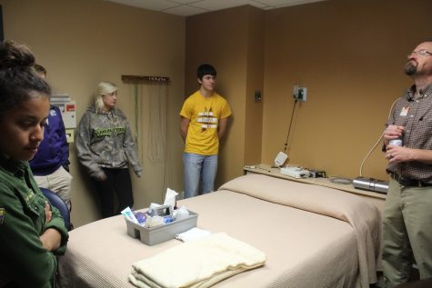 Students stand in the sleep analysis room at the Sleep Center.