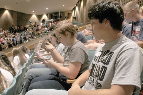 Senior Tanner Callis listens to the main speaker.