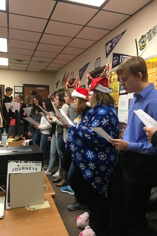 Spanish II class carols around school