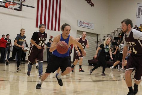 Teachers defeat students during pep assembly basketball scrimmage