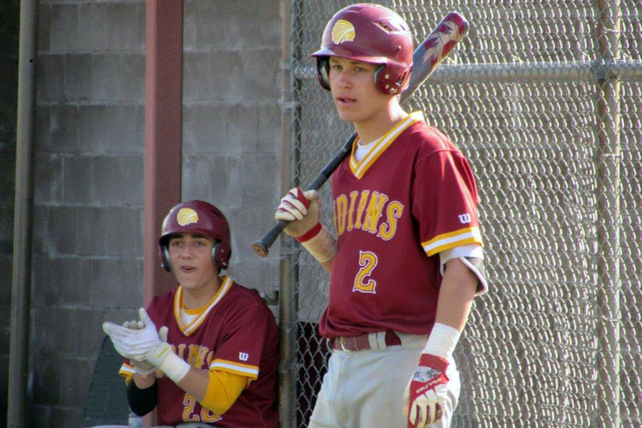Junior+Dawson+Harman+waits+for+his+turn+to+bat+while+senior+Jace+Armstrong+cheers+on+his+batting+teammate+during+the+2017+season.+Harman+is+now+a+senior+while+Armstrong+graduated.
