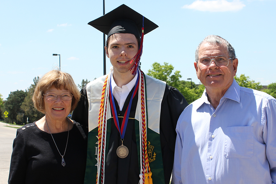 Christopher Rooney poses for a photo after his graduation at KU. He is joined in this photo by his grandparents Noel and Sharon Rooney. Christopher graduated from KU with a Bachelor's in Astronomy and Physics.