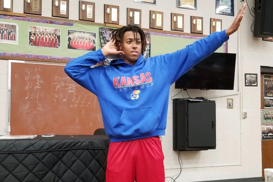 Senior+Tay+Otte+poses+for+a+picture+demonstrating+one+of+the+dance+moves+he+taught+concert+choir.+This+particular+move+he+taught+to+the+tenor+and+bass+sections.+Tay+Otte+currently+plans+to+attend+the+University+of+Kansas+after+high+school+with+an+emphasis+in+biology.